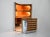 The set includes a cabinet with three illuminated shelves in suede, chrome-plated metal, and brass. It also includes a...