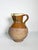 A ceramic pitcher, France, 1960s, with rustic and authentic charm. Made of terracotta with a nuanced warm brown glaze, it...