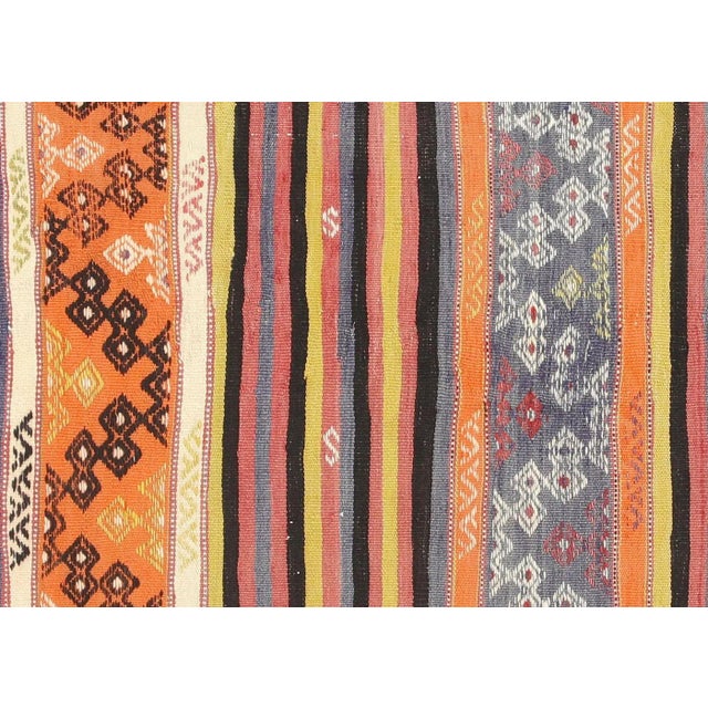 Bring a unique and traditional style to your home with this handcrafted Vintage Turkish Kilim. Boasting a classic wool-on-...