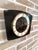 Rare vintage wall clock made in France by ODO, featuring a geometric design and a rectangular case with a wood finish. The...