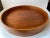 A beautifully crafted large round tray in form-pressed teak assembled without the use of metal. It has two useable sides....