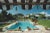Pool in sotogrande' slim aarons estate print giant estate stamped limited edition print by slim aarons bathers round a...