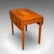 This is an antique Pembroke Table. An English, satinwood drop-leaf occasional or tea table, dating to the Regency period,...