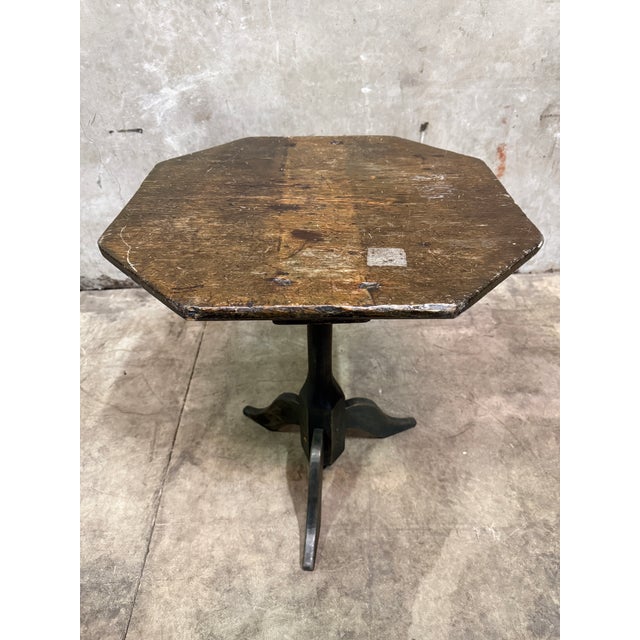 A characterful antique tripod side table with genuine age and a wonderful old surface. The octagonal plank top with...
