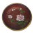 A small plate that glimmers with patient artistry. Against a field of deep red enamel, a peony blooms in soft pink, its...