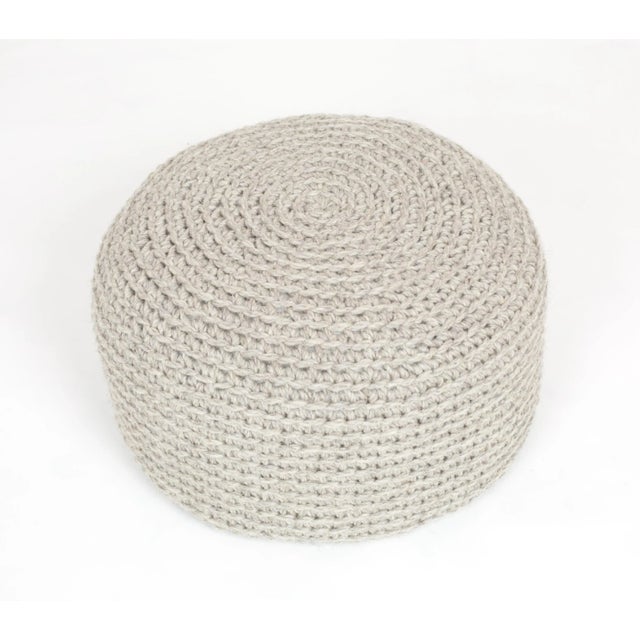 This crocheted pouf is made from 100 % natural wool. The bean bag has a very nice and quite rough texture with a rustic...