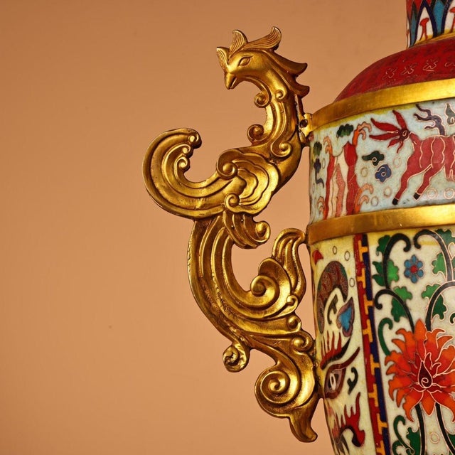 This extraordinary pair of monumental Chinese vases is crafted from copper with vibrant cloisonné enamel work and...