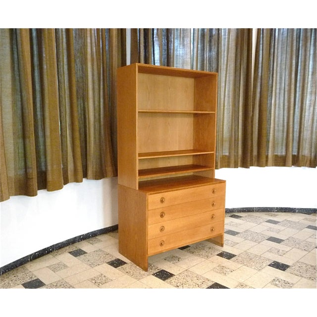 This Danish high-quality RY-100 modular wall unit system was designed by Hans J. Wegner for Ry Møbler in the late 1950s....