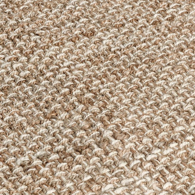 Hand spun and braided jute rug in a natural and ivory subtle stripe design. Available in numerous sizes. Please note that...