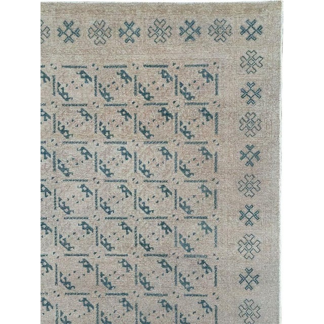 This Mid-20th century Turkish Anatolian room-size carpet presents a finely ordered allover composition in a restrained...