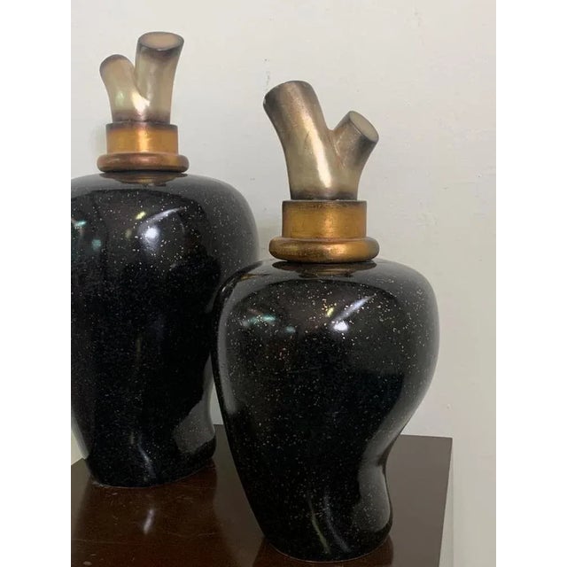 Vases with silver cap and gold internally decorated in black dotted in gold. Large measures h.57 x diam.26 Small H.47 x...