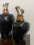 Vases with silver cap and gold internally decorated in black dotted in gold. Large measures h.57 x diam.26 Small H.47 x...