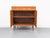 High-quality teak cabinet with two hinged doors and one drawer, each featuring stylish recessed handles. Inside, there's...
