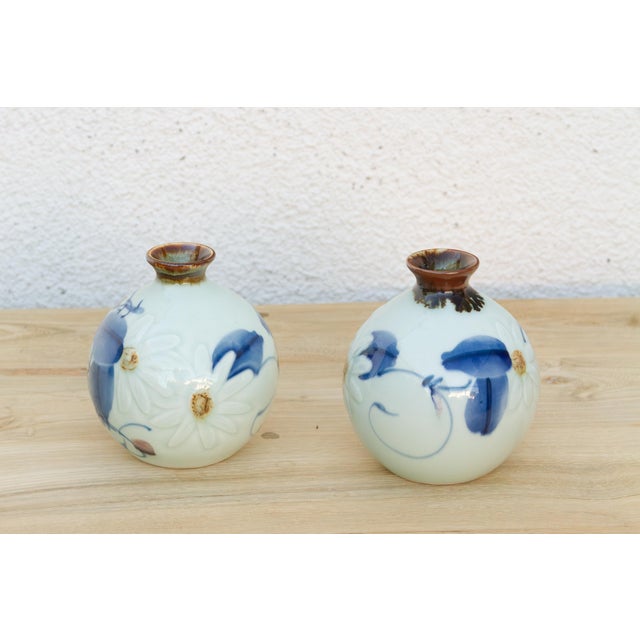 These two vases aren't decorated with the same motif, worth noting upfront so a buyer isn't expecting mirror images. Both...
