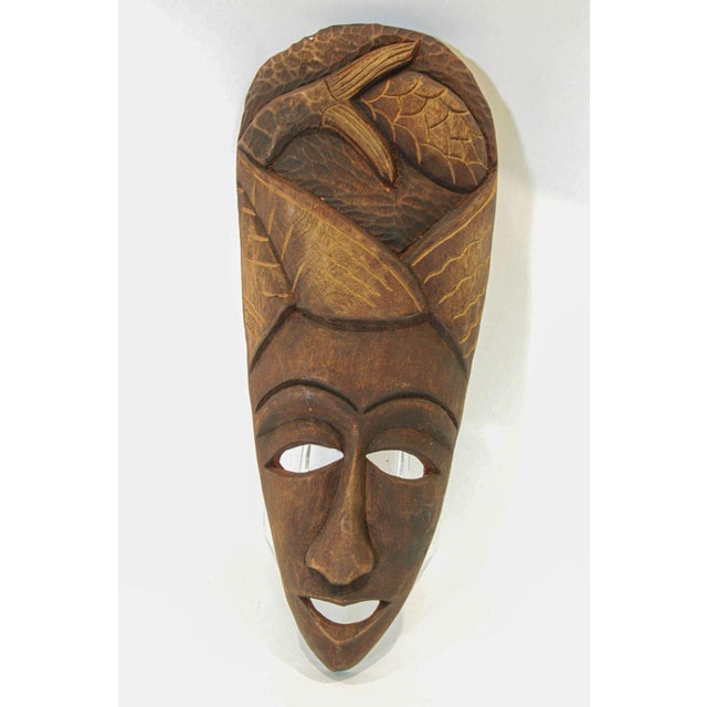 Vintage African Wood Decorative Mask, hand-carved African mask from Ghana of a smiling lady face with a nice hairdo....