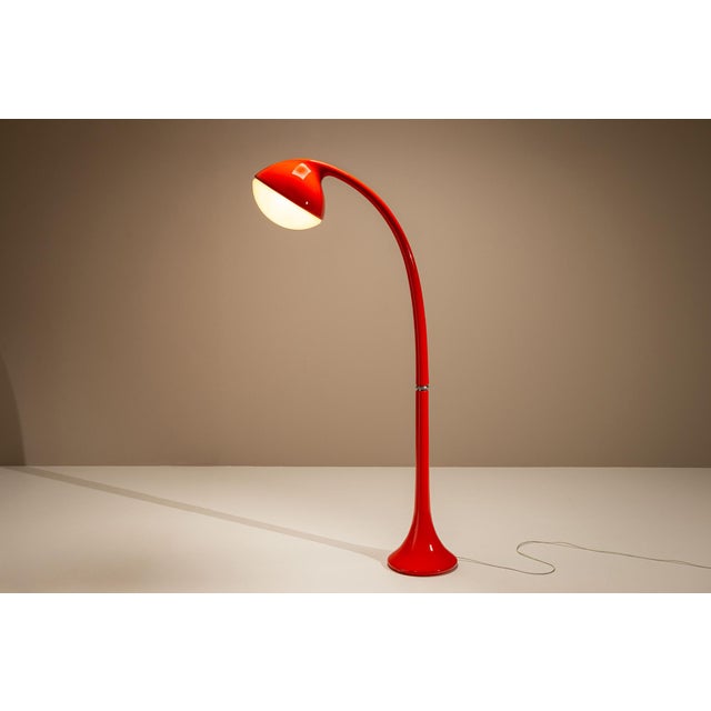 A futuristic gesture in glossy red, the dl5 floor lamp by fabio lenci is a sculptural icon of early 1970s italian lighting...