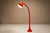 A futuristic gesture in glossy red, the dl5 floor lamp by fabio lenci is a sculptural icon of early 1970s italian lighting...