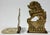 Pair of vintage flip down brass bookends with Asian motif. One features Asian symbol for good luck, the other a detailed...