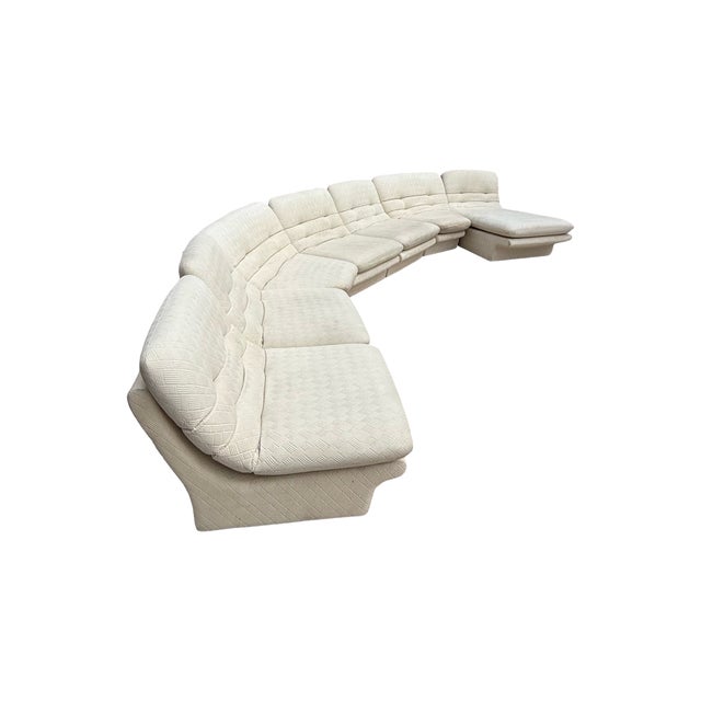 A beautiful vintage 1980s seven-piece modular sectional with a sculptural curved silhouette and chaise. This sofa has that...