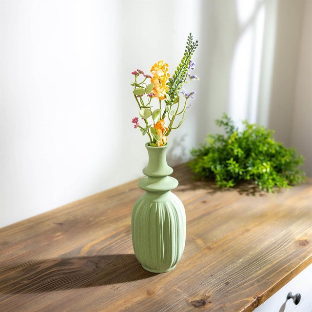 Refresh your space with the soft, modern elegance of this Ribbed Green Stoneware Vase Set. Featuring a calming sage green...