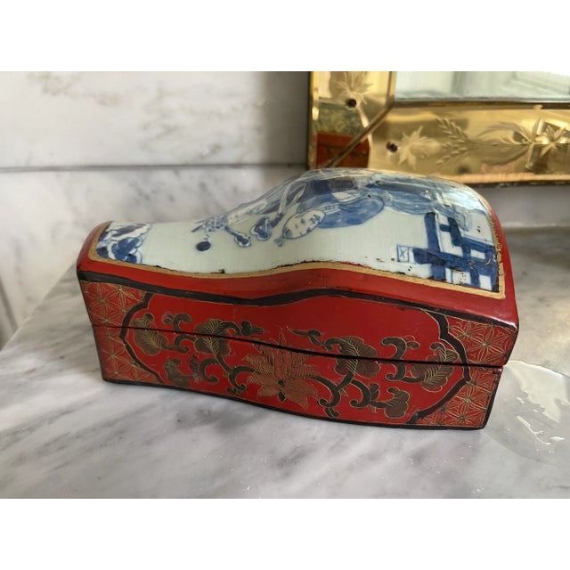 Beautiful red and blue box that incorporates ceramic and lacquered wood elements. Elegant and fun!