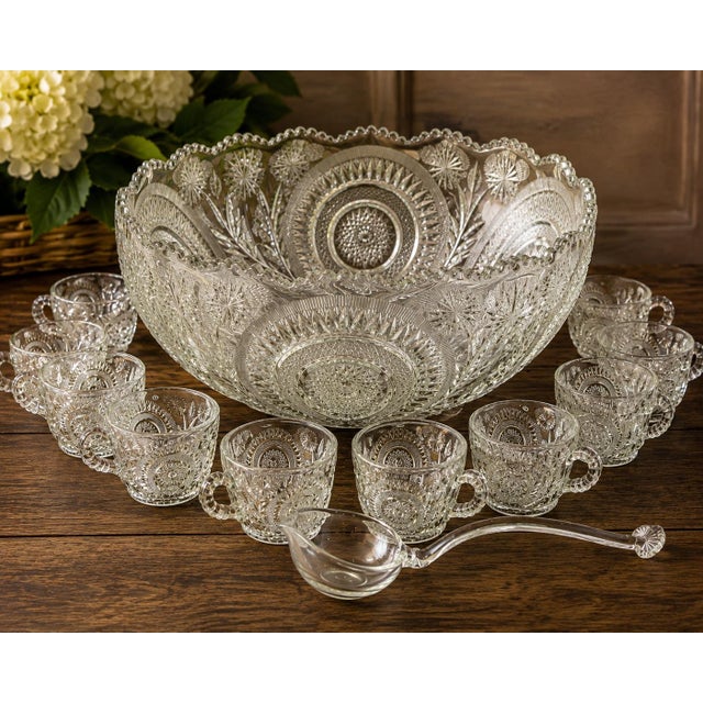 A spectacular vintage pressed-glass punch set in the Slewed Horseshoe / Pinwheel & Stars pattern, attributed to L.E....