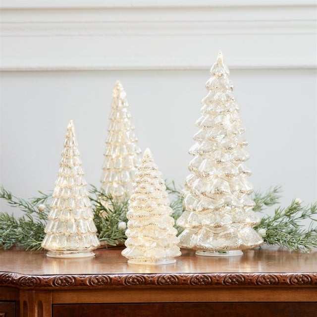 Bring a warm, festive glow to your holiday decor with this stunning set of LED Mercury Glass Christmas Trees. Designed...