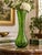 Striking vintage Bohemian art glass vase crafted in translucent green glass and decorated throughout with delicate hand-...