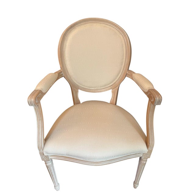 This French provincial cream side chair brings a charming touch to any home! The light, airy color palette blends the...