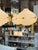 Striking Stilnovo chandelier featuring six sculptural opaline glass shades arranged around a central frame. Each globe-...
