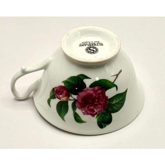 Vintage Royal Sutherland fine bone china teacup and saucer set from the 1970s. This set features a floral pattern of...