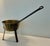 Antique brass bowl saucepan with three iron legs and handle finished with a loop. Not polished and there is residue in...