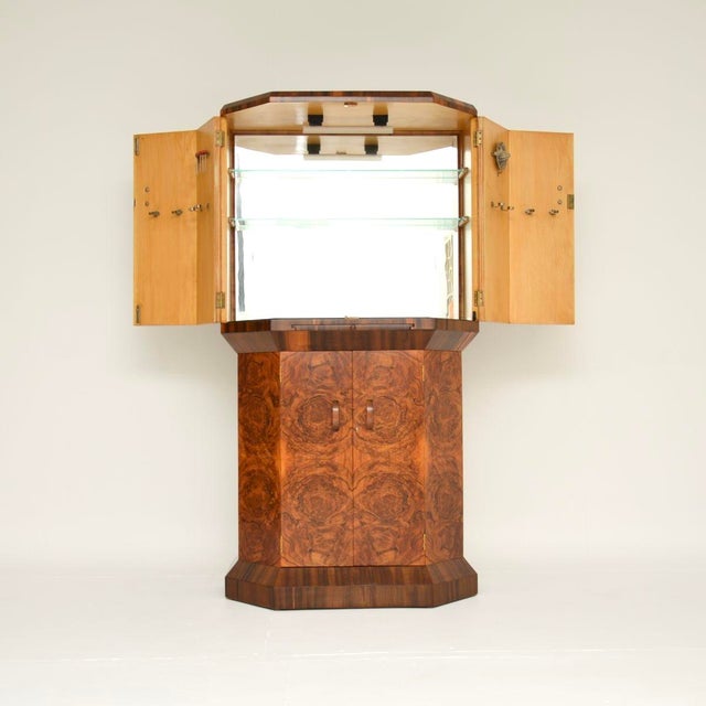 A magnificent Art Deco burr walnut cocktail drinks cabinet of the highest order. This was made in England, it dates from...