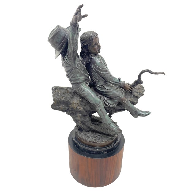 This finely detailed bronze sculpture, signed “J. Davidson,” presents a dynamic and expressive figurative composition...