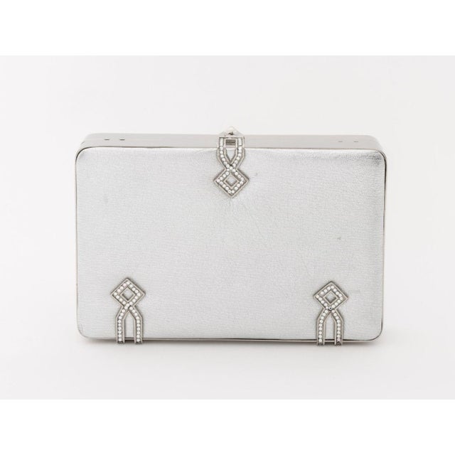 Judith Leiber Silver-Tone Metallic Silver Leather Evening Clutch, with art deco style crystal encrusted accents with...