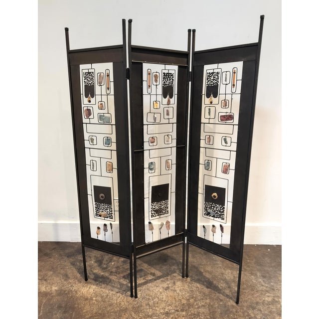 Quirky Po-Mo iron folding screen with wired-in wood, stone and decorative cut iron elements. Circa late 80's early 90's....