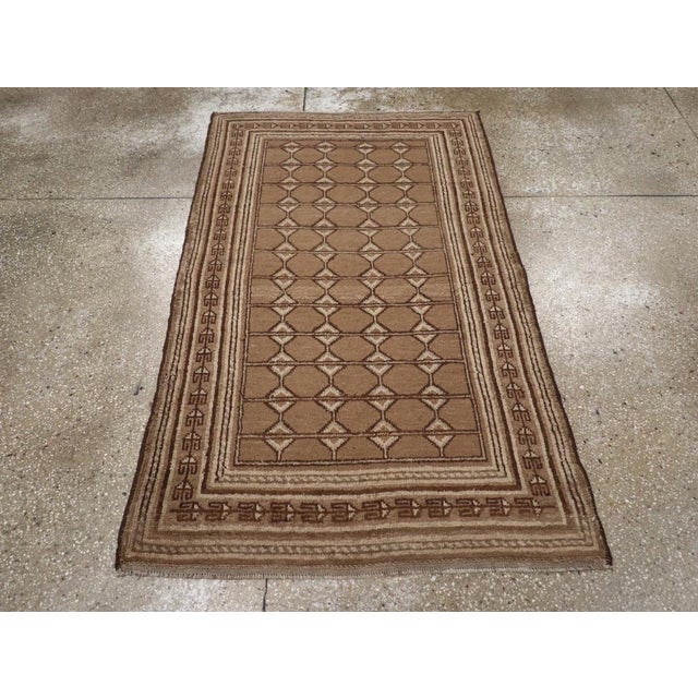 A vintage East Turkestan Samarkand throw rug handmade during the Mid-20th century. Measures: 3' 4" x 5' 5"