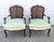 A beautiful pair of vintage French Louis XV–style bergère armchairs featuring gracefully shaped exposed wood frames,...