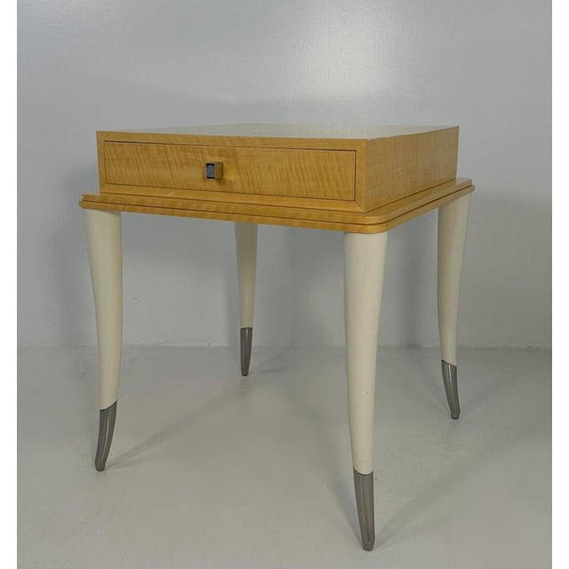 Elegant Italian side table produced in the 1980s, distinguished by a refined combination of maple wood, cream lacquer and...
