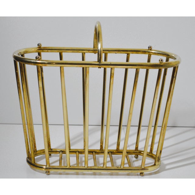 MCM Brass Oval Spindle Magazine Rack Holder. It's used in good vintage condition with normal signs of wear, contains faint...