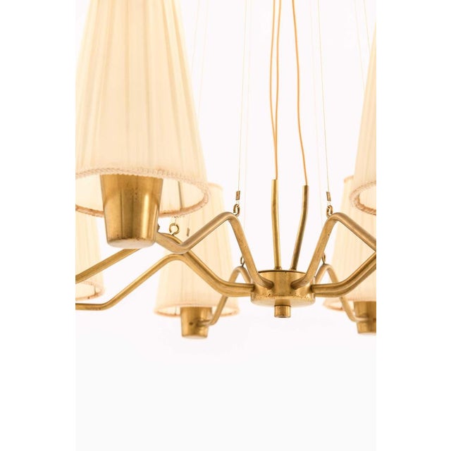 This very rare ceiling lamp, designed by Hans Bergström and produced by Asea in Sweden, is a distinguished example of mid-...