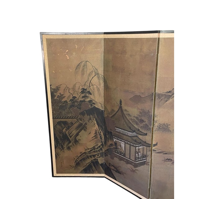 Stunning depiction of a Japanese landscape scene of harvesting blackberries, in the use of gold tones. The black wood...