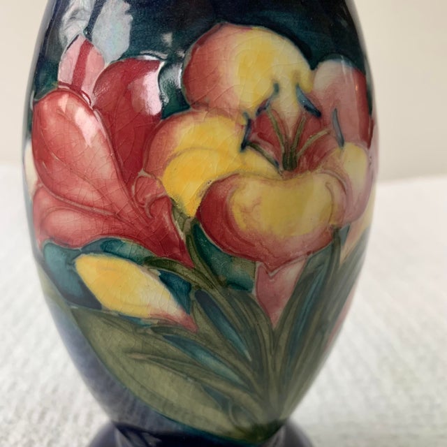 Beautiful and Collectible Moorcroft Art Pottery Vase in "Freesia" pattern designed by Walter Moorcroft around 1950. The...