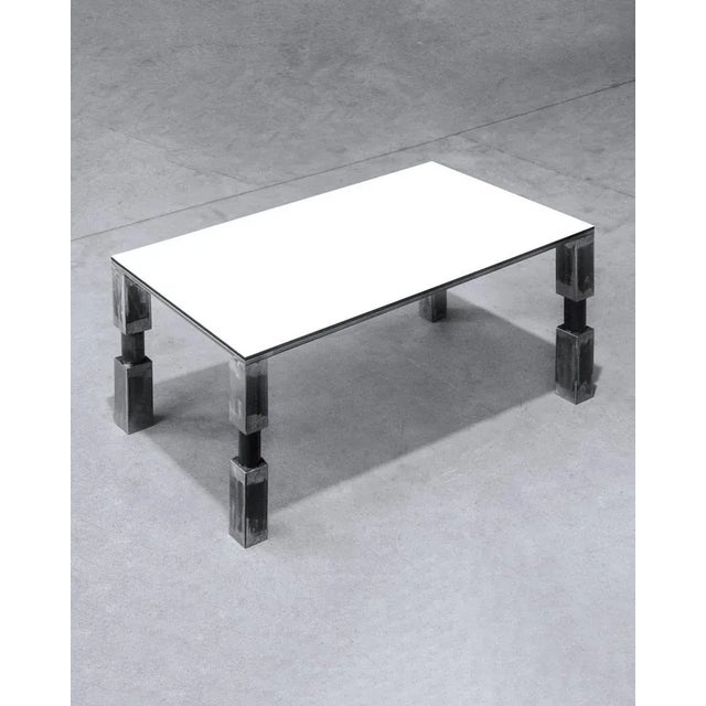 The T–T01 is a very versatile table which stands out for its clear yet raw shapes. The lines of the 4 legs flow seamlessly...