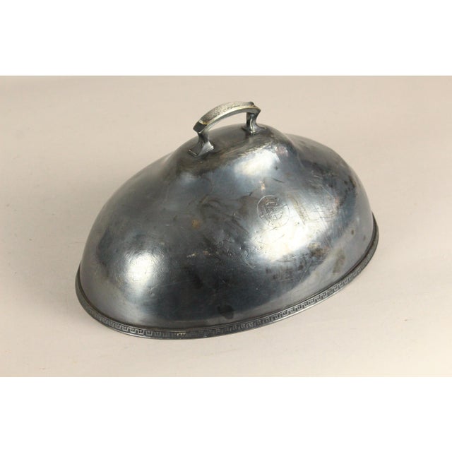 An impressive serving piece An oval domed cover for serving turkey or meat on a silver platter Large and heavy, thickly...