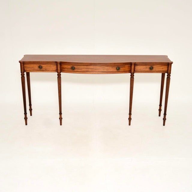 A very impressive and very wide antique Georgian style console table, made in England and dating from around the 1930’s....