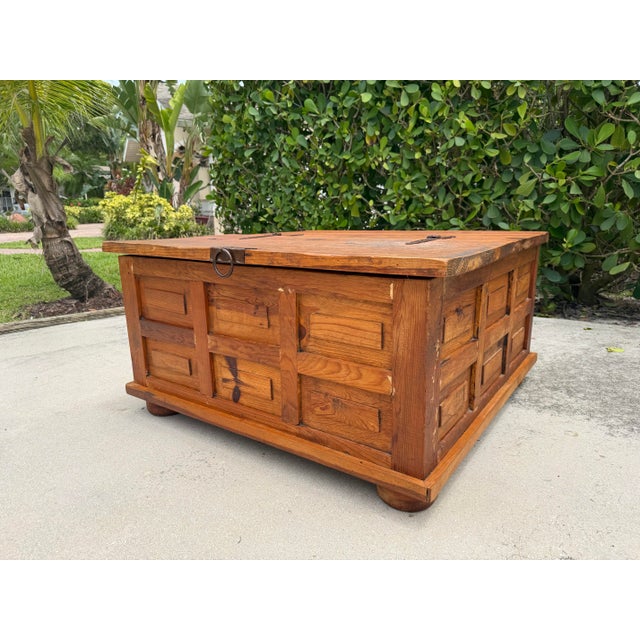Crafted in Mexico, this oversized square pine trunk offers the warmth and character of traditional rustic furniture while...