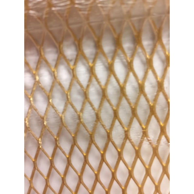 Mid century modern brass serving tray. Features mesh brass encased in glass.