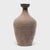 This ceramic jar from China's Shandong province has a bottle-neck shape meant for storing vinegar or wine made from rice...