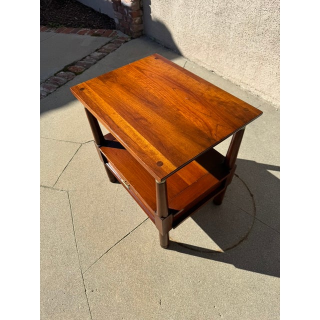 This beautiful Willett Furniture cherry wood nightstand from the renowned Trans-East collection is a rare and...